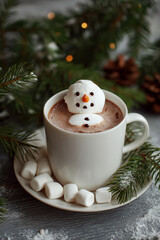 Warm mug of hot cocoa with a marshmallow snowman inside, perfect for a cozy winter day.