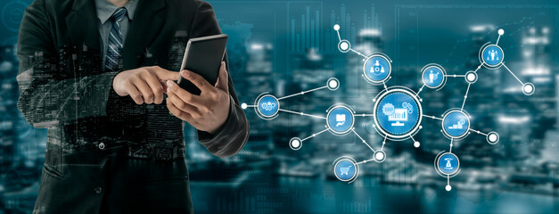 A business professional engages with a smartphone amid a digital landscape, illustrating the intersection of technology, connectivity, and modern business solutions. Tessel