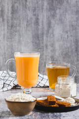 Protein shakes, protein powder, green tea and protein bars for clean eating vertical view