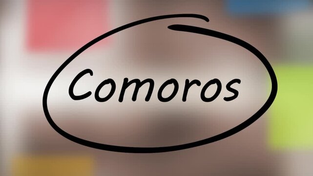 Comoros Black Marker Writing on Glass Surface_2