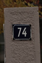 building, flight, board, transportation, signage, exit numbers , yellow