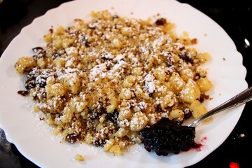 Kaiserschmarrn with powdered sugar and jam