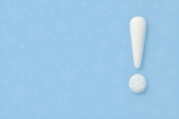 Obraz premium Winter Exclamation Mark Symbol Made of Snow and Snowflake on Light Blue Background