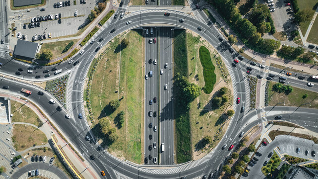 High-angle view of a traffic circle with cars moving through the roadways and junctions, Vilnius, Lithuania