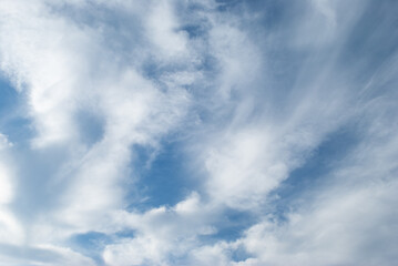 white clouds in a soft blue sky