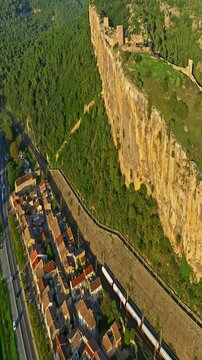  Mornas Fortress stands majestically on top of a rocky cliff. The Fortress of Mornas is a medieval fortress above the village of the same name in the French department of Vaucluse