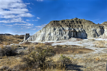 Badlands with hoodoo and moon overhead