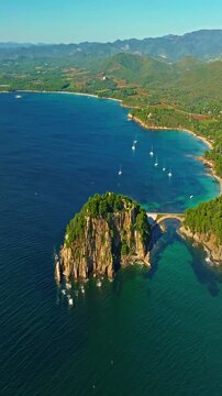  Aerial view of Fort Bregancon sunset aerial view from the mediterranean sea. A yacht is anchored near the fortress