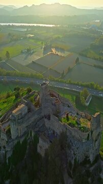  Mornas Fortress stands majestically on top of a rocky cliff. The Fortress of Mornas is a medieval fortress above the village of the same name in the French department of Vaucluse