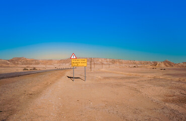 street sign firing zone for next 39 kilometer in the desert Negev in Israel.