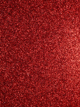 Sparkling red glitter texture for festive background