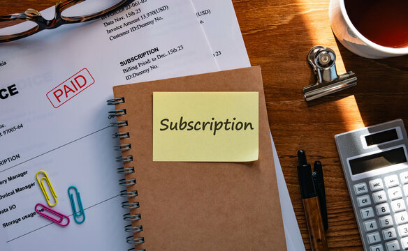 There is sticky note with the word Subscription. It is as an eye-catching image.