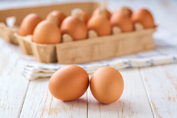 raw chicken eggs  on a white table, selective focus.
