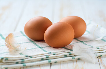 natural farm chicken eggs  on a white table, selective focus.