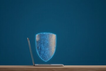 Finger scanning biometric sensor concept. Digital shield concept protecting a laptop on a wooden surface.