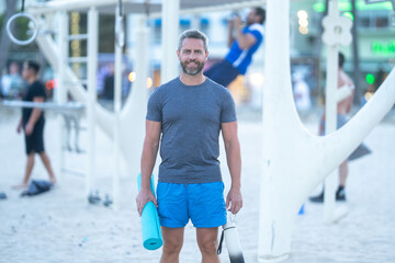 Outdoor fitness training outside. Fit training in public park. Workout outside. Fit workout outdoors. Outdoor fitness exercises. Fit guy in fitness training. Sportsman performing fitness routine.