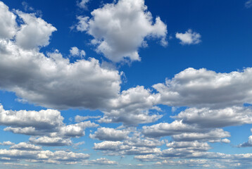 Fototapeta premium Clean sky with scattered clouds banner. Beautiful sky background. Calm sky layer. Air sky with white clouds horizon. Tranquil clouds in daylight. Idyllic skyline panorama.