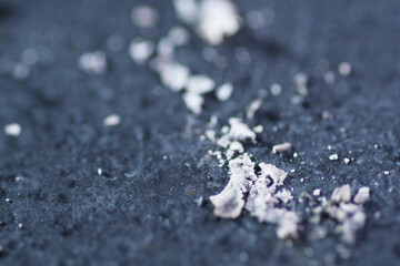 Macro shot of cigarette ash on the ground
