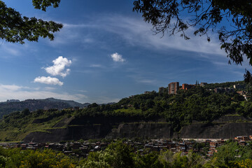 Fototapeta premium Caracas, Venezuela. View of the Miranda residential area along the highway to the east of the country. Gran Mariscal de Ayacucho Highway. Neighborhoods near the eastern bus terminal