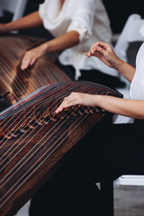 Traditional Korean folk musical instrument Gayageum, female orchestra band performing concert on Kayagum in of Seoul, South Korea, wooden zither with 12 strings, Koto or Guzheng live music performance
