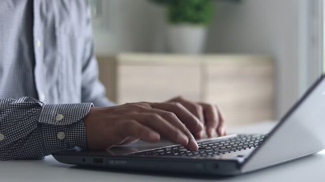 Businessman working on a laptop to login password two-step authentication, verification code on smartphone screen for identity identification for online banking, 2FA Cyber security protection concept.