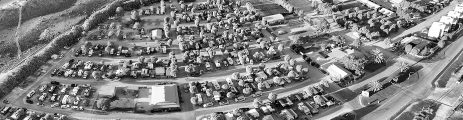 Aerial panoramic view of Coral Bay camping site in Western Australia with turquoise waters and sandy beach