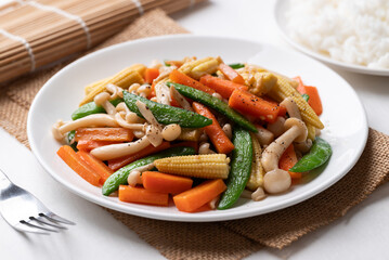 Stir fried vegetables, Green pea, Carrot, Baby corn and Shimeji mushroom with soy sauce, Asian vegetarian food, Healhty eating