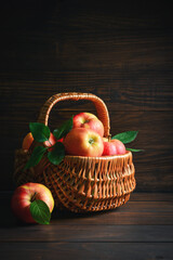 Ripe apples in a wicker basket