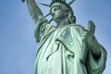 Detailed view of Statue of Liberty’s sculptural elements and textured surface in New York Harbor © jovannig