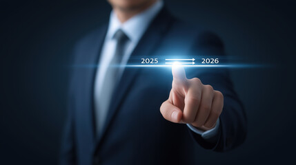Businessman touch progress from 2025 to 2026, Planning strategy in new year 2026 Concept. New business startup in 2026. 2025 is loading to 2026.