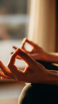 Find inner peace with serene yoga practice, hands in mudra pose, sunlit zen moment for mindfulness and relaxation
