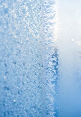 Delicate Ice Crystals Forming on a Window on Cold Day in Winter