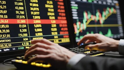 Professional trader uses keyboard and mouse analyzing dynamic stock market data and financial charts on multiple computer screens for strategic investment decis - Powered by Adobe