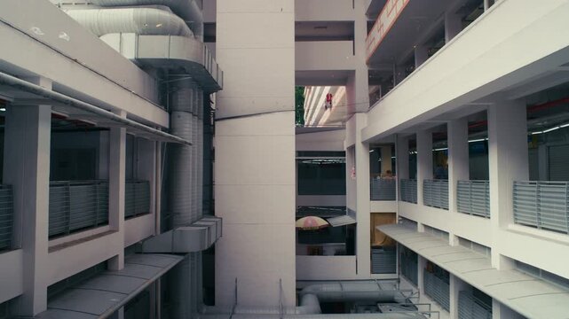 Brutalist Apartment Building in Singapore &ndash; High-rise architecture with laundry poles and geometric urban design.