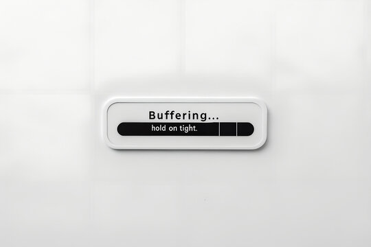 Loading screen: A simple, sleek interface showcasing a buffering indicator, its progress bar slowly filling as the words Buffering...hold on tight invite the viewer to pause and wait.
