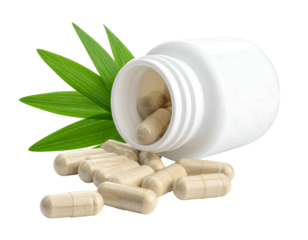 Pills spill from a white bottle, nestled against vibrant green leaves, against a black backdrop