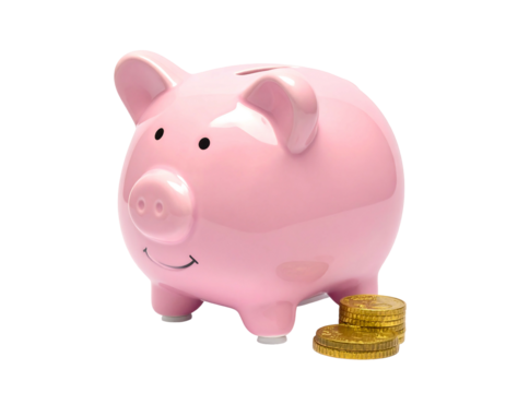 Pink ceramic piggy bank with smiling face sits near a stack of gold coins on a white background