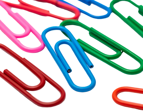 A macro photo of colorful paperclips against a black background. Close up bright, vivid, and flat lay composition