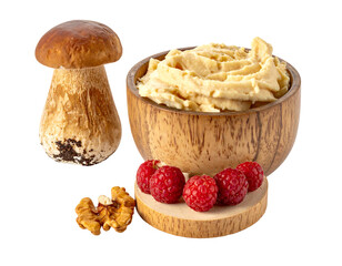Still life mushroom, creamy spread in wooden bowl, raspberries, walnut. Isolated on black background