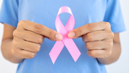 Pink Ribbon for Breast Cancer Awareness Held by Woman's Hands
