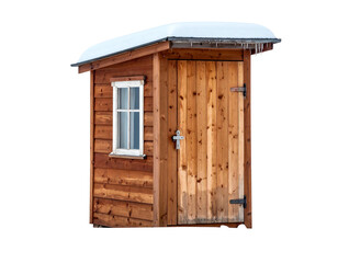Small wooden shed with snowy roof. One window, a door with metal hardware. Isolated on a black background
