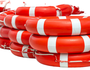 Stack of bright red and white life preservers, arranged in a haphazard pile, offering safety and reassurance