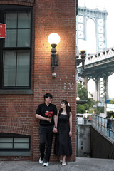 lovely couple looking at each other for their wedding photoshoot, with roses