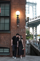 couple kiss after propose, dumbo, NY