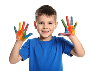 Smiling boy with colorful painted hands against a black background, showcasing bright primary colors