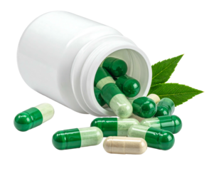 Green and white capsules spill from a white bottle, accompanied by fresh green leaves on a dark background