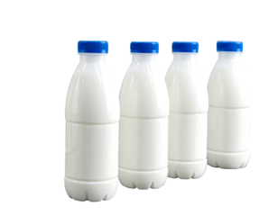 Four plastic bottles filled with white liquid, all capped with blue lids, on a black background, in diagonal alignment