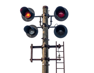 Four railroad signals attached to a wooden pole against a black background with metal ladder