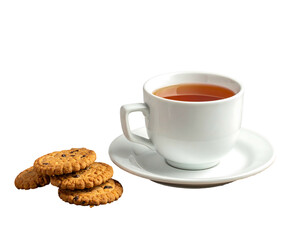 Tea cup sits on saucer with chocolate chip cookies near. Black backdrop
