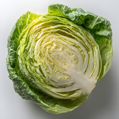 Fototapeta premium Fresh Halved Green Cabbage with Leafy Texture and Vibrant Color for Culinary or Health-Related Imagery
